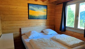 Luxurious wooden chalet - master bedroom with double bed