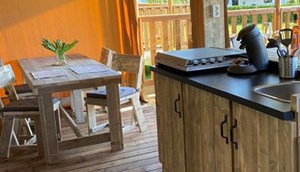 Safari tent Borky - cosy seating area and dining table